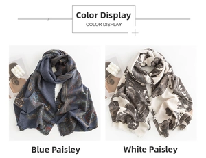 Close-up of blue and beige paisley scarves with tassel edges in soft cashmere-like fabric