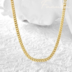 Classic gold-plated Cuban link chain necklace displayed on a minimalist white background