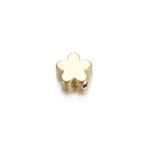 Detailed view of a gold-plated flower-shaped metal bead for DIY jewelry making