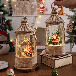 Detailed view of Christmas crystal ball with LED warm light and snowy scene decoration