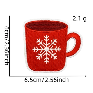 Detailed macro of embroidered mug patch with snowflake pattern and size dimensions