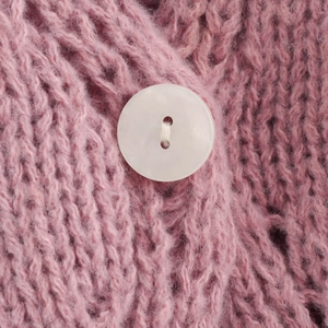 Short sleeve V-neck pink chunky knit cardigan with a single pearlescent button detail
