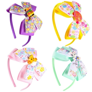 Set of four colorful Easter-themed bow headbands with cute egg and bunny charms