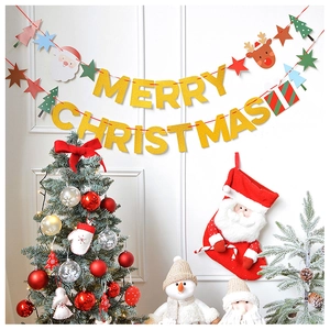 Close-up of glittery Gold Merry Christmas banner and festive indoor holiday decorations