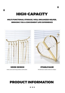 Detail showing the metal jewelry stand with multiple hooks and a stable weighted heart base