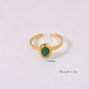 Detail of 10mm green stone gold open ring with weight specification of 1.3g