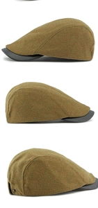 Detail view of tweed flat cap featuring olive brown texture and black faux leather brim