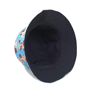 Close-up of sky blue reversible bucket hat with cartoon pug and red heart pattern prints
