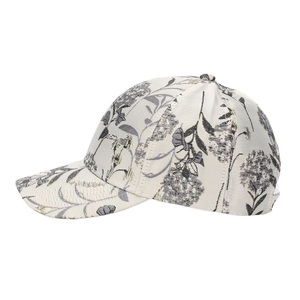 Detail of ethnic floral jacquard pattern on cream-colored women's baseball cap fabric
