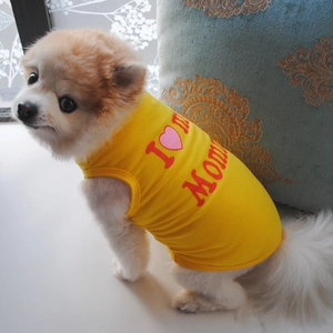 Detail of yellow dog vest with I Love Mom print and breathable cotton fabric texture