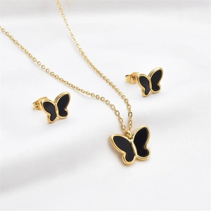 Elegant butterfly jewelry set with necklace and earrings in black and gold stainless steel