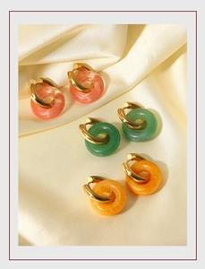 Detail view of retro 18K gold plated hoop earrings with pink emerald and amber stone hoops