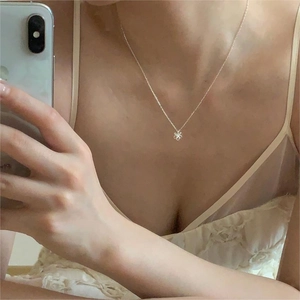 Mirror selfie showing the 925 sterling silver floral pendant necklace on a neck