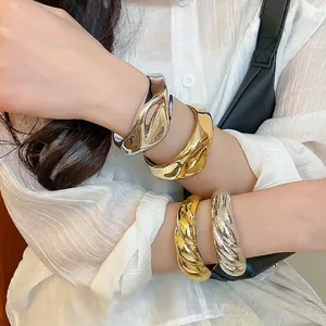 Minimalist chunky acrylic twisted and wide irregular metal bangles in gold and silver