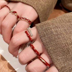 Detail of 14k gold plated red enamel bamboo ring with vintage textured patterns