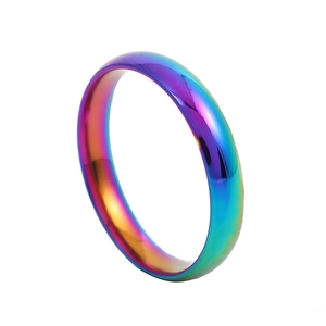 Detailed view of 2mm rainbow stainless steel ring with smooth domed surface and glossy finish