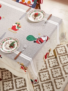 Detailed embroidery of Santa Claus and gift sleigh on American style Christmas tablecloth