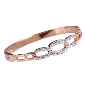 Rose gold geometric bangle featuring triple oval links with pavé crystal accents