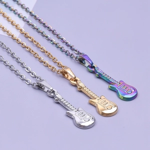 Detailed view of guitar pendant necklaces in silver, gold, and rainbow gradient finish