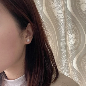 Close-up of white freshwater pearl earrings 8-10mm on ear with S925 silver studs