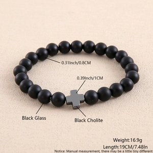 Detail view of black glass and hematite bead bracelet with 0.8cm beads and cross charm