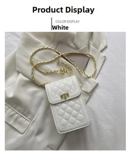 Detail of white quilted crossbody phone bag with gold chain strap and square metal lock