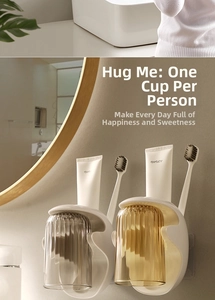 Detail of wall-mounted magnetic mouthwash cups with elegant vertical stripe texture