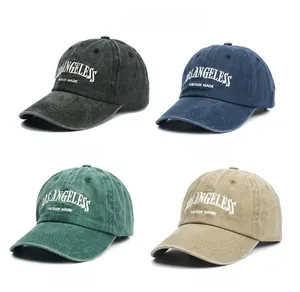 Close-up of four vintage washed cotton baseball caps with embroidered lettering