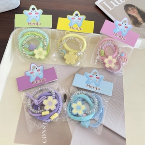 Five-pack candy colored floral hair ties with elastic bands and bead charms for women