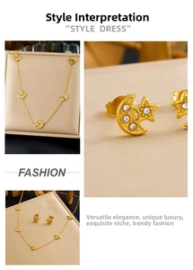 Detailed view of gold plated star and moon jewelry set with sparkling crystals