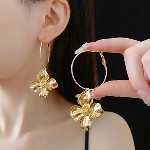 Chic oversized gold flower hoop earrings with realistic petal design for women