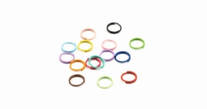 Close-up of colorful DIY open rings in various shades for jewelry and crafts making