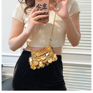 Close-up of a gold sequin crossbody mini bag featuring a stylish metal chain strap