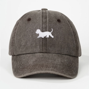 Close-up of white dog embroidery on washed charcoal grey baseball cap with stitching