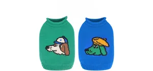 Detail of green and blue knit pet sweaters featuring cute cartoon dog patterns