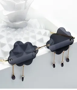 Close-up of cloud-shaped rimless sunglasses with hanging purple raindrop charms