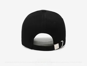 Rear view of black baseball cap showing the cotton twill texture and silver metal buckle