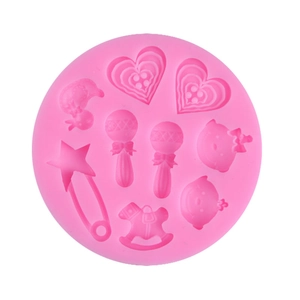 Pink silicone baby shower cupcake mold with rattle, rocking horse and safety pin patterns