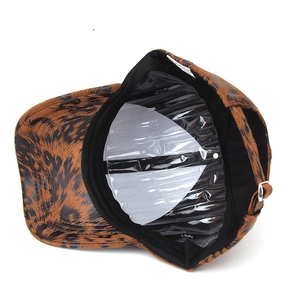 Detail view of the brown leopard baseball cap with adjustable metal buckle and black lining