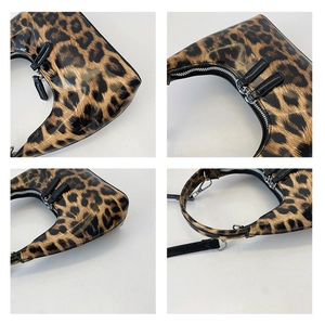Detail shots of glossy leopard print handbag with silver zippers and black strap