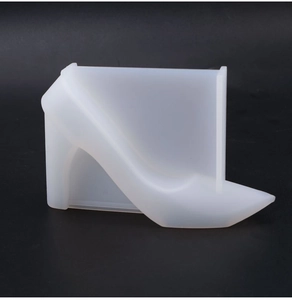Detailed translucent silicone mold showing the streamlined silhouette of a high heel shoe