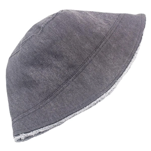 Detail of washed denim bucket hat with frayed edges and double stitching in dark grey finish
