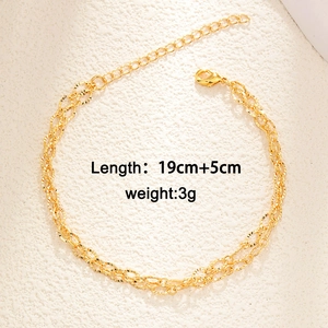 Double-layered gold bracelet with emerald zircon heart and wheat chain design