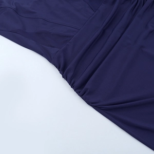 Close-up of deep blue knitted fabric and breathable mesh stitching on the dress