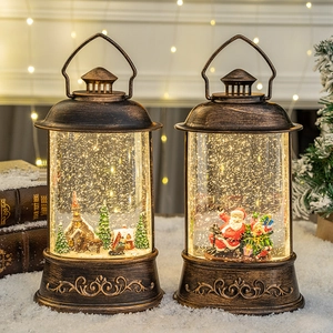 Vintage bronze Christmas lantern music box with Santa and church scenes in warm LED light