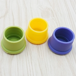 Three colorful food-grade silicone protective sleeves in green yellow and purple colors