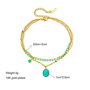 Bohemian gold chain bracelet with turquoise oval pendant and 18K gold plating detail