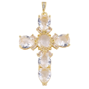 Detail of gold cross pendant featuring pear-shaped zircons and crystal embellishments