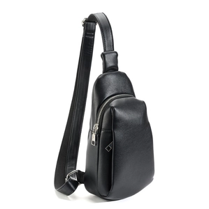 Front view of a black PU leather chest bag for women with adjustable strap on white background
