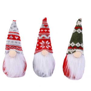 Three Christmas gnomes with snowflake knitted hats in red, grey, and green colors